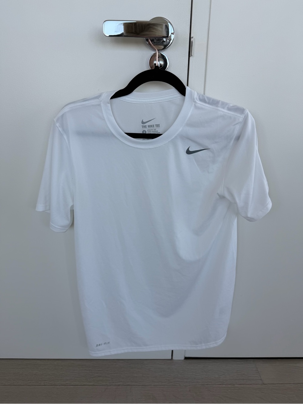 Nike White Short Sleeve Sports Tee with Gray Swoosh